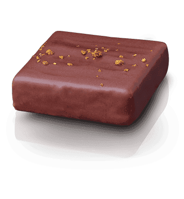Reines Marzipan aus aromatischen Mittelmeermandeln, verfeinert mit reinem Orangenöl und Wasser von der Orangenblüte.